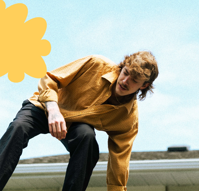 a photo of singer Nolan Hubbard climbing a roof